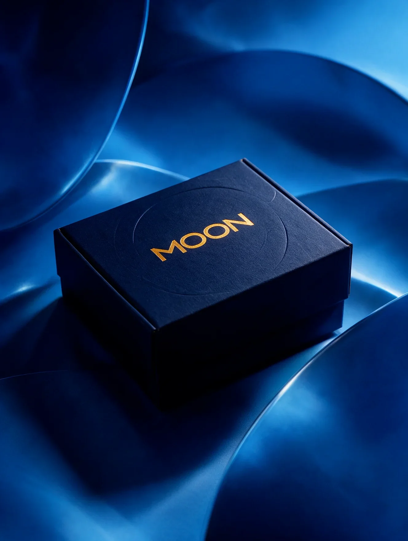 Dark Moon branded box with a gold wordmark on a blue reflective surface
